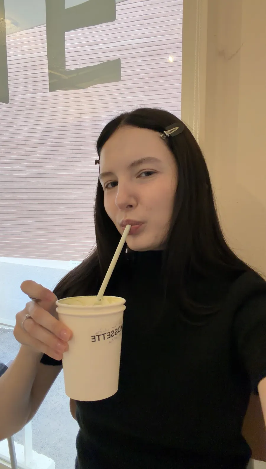 Me with a drink at a café