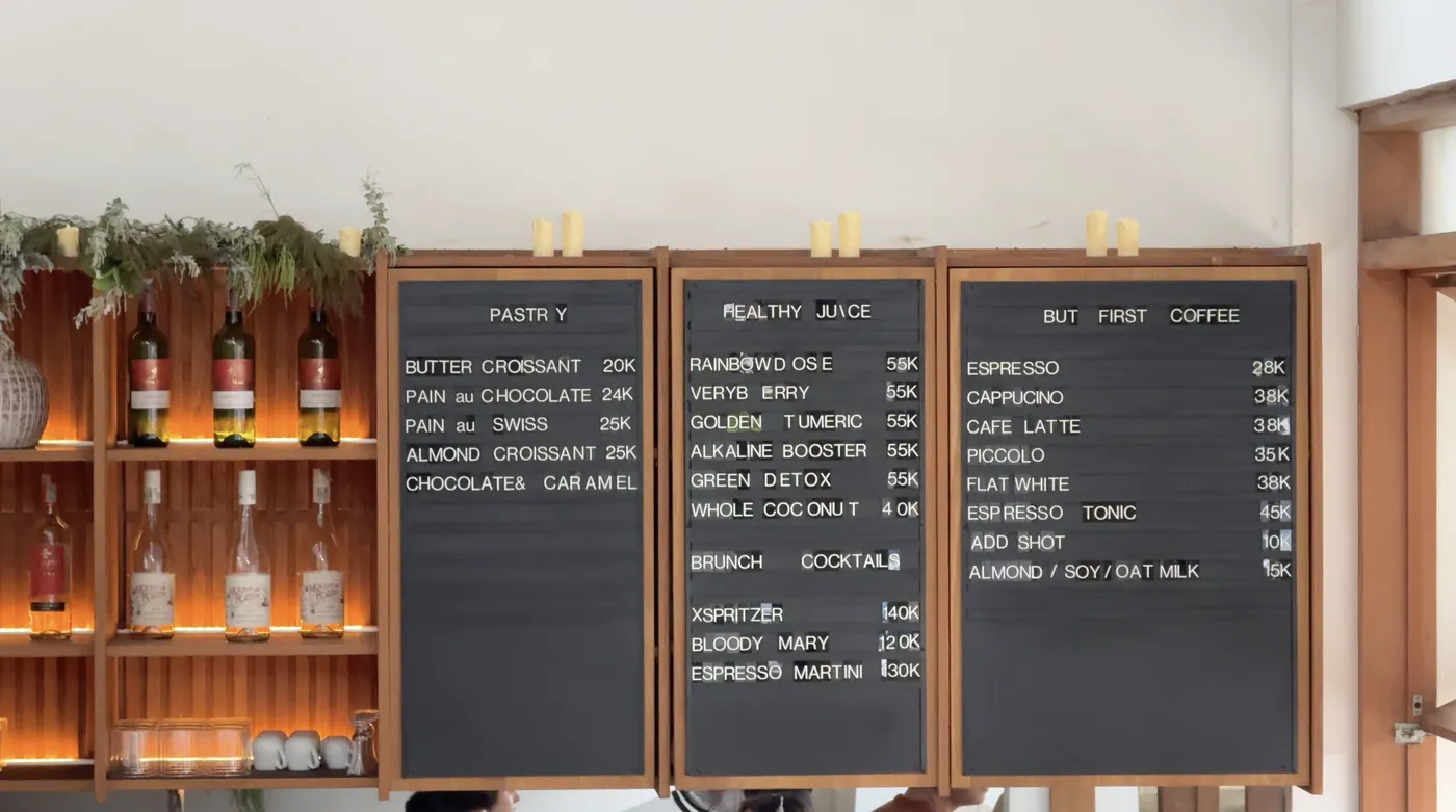 Chalkboard menus with pastries, healthy juices and coffee