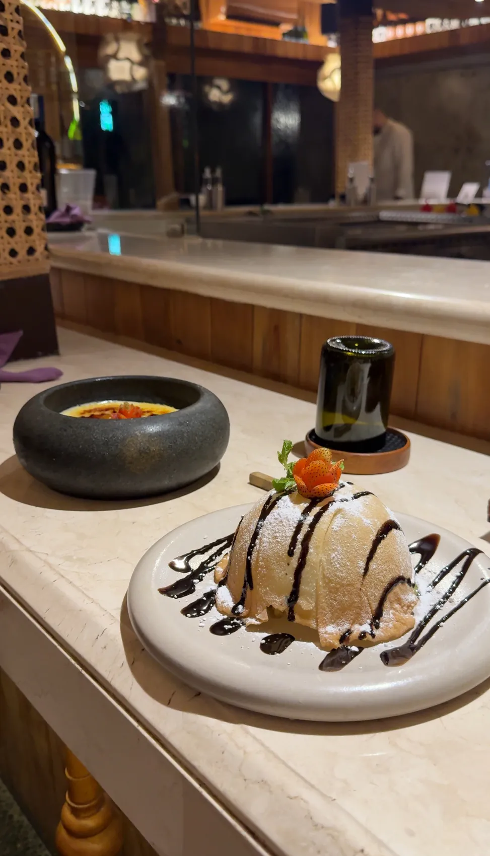 A dessert with chocolate sauce on a white plate