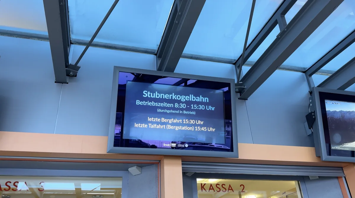 A Stubnerkogelbahn display listing operation from 08:30 to 15:30, last ascent at 15:30 and last descent at 15:45.