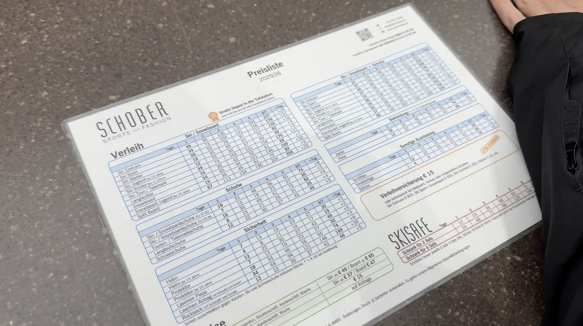 A Schober rental price list headed 2025/26, laid on a counter.